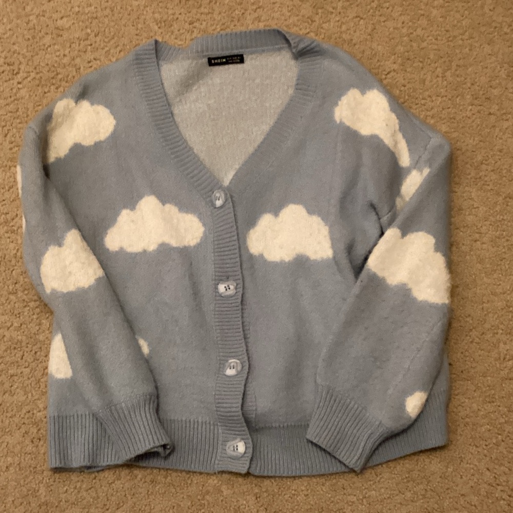 Light blue cardigan with clouds design